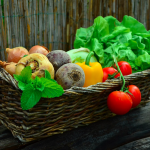 Woven basket full of garden vegetables.